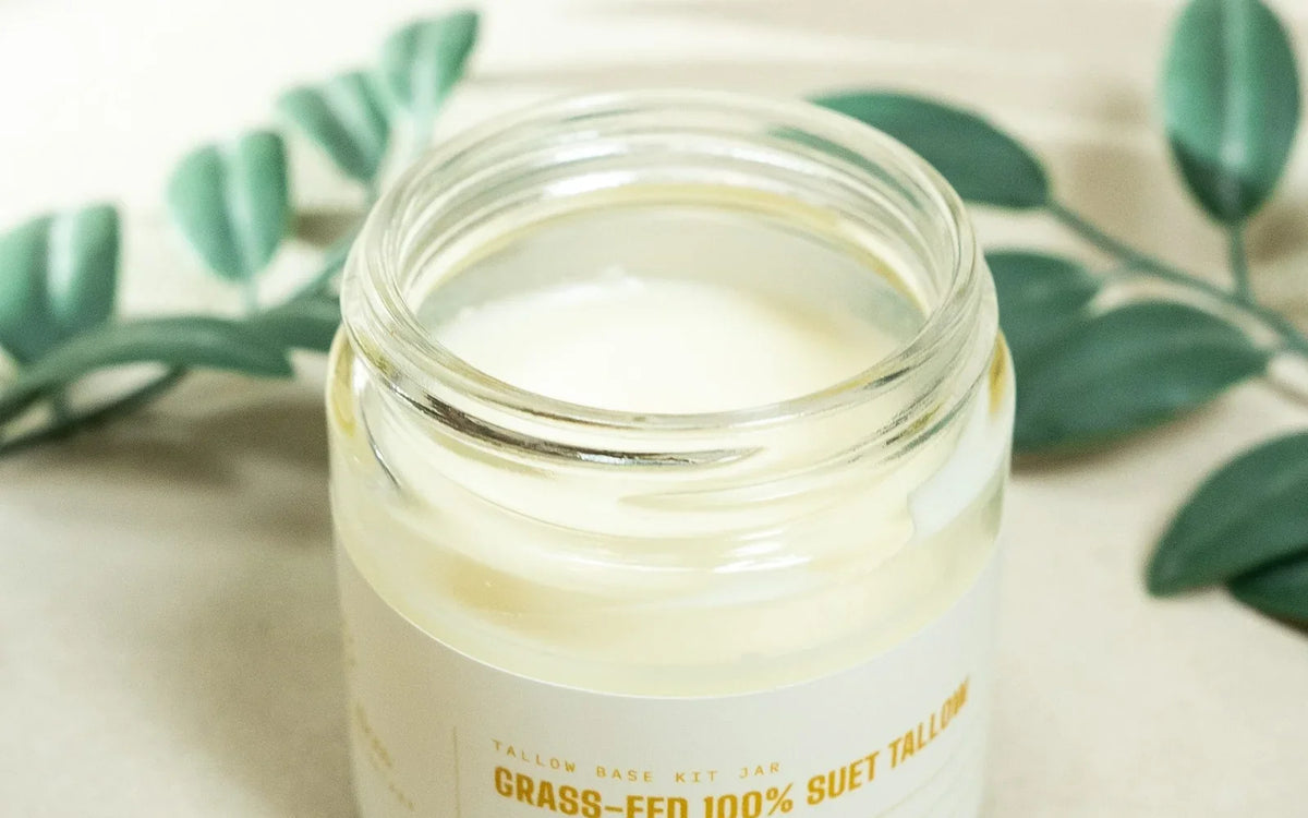 An open jar of pale rendered suet tallow