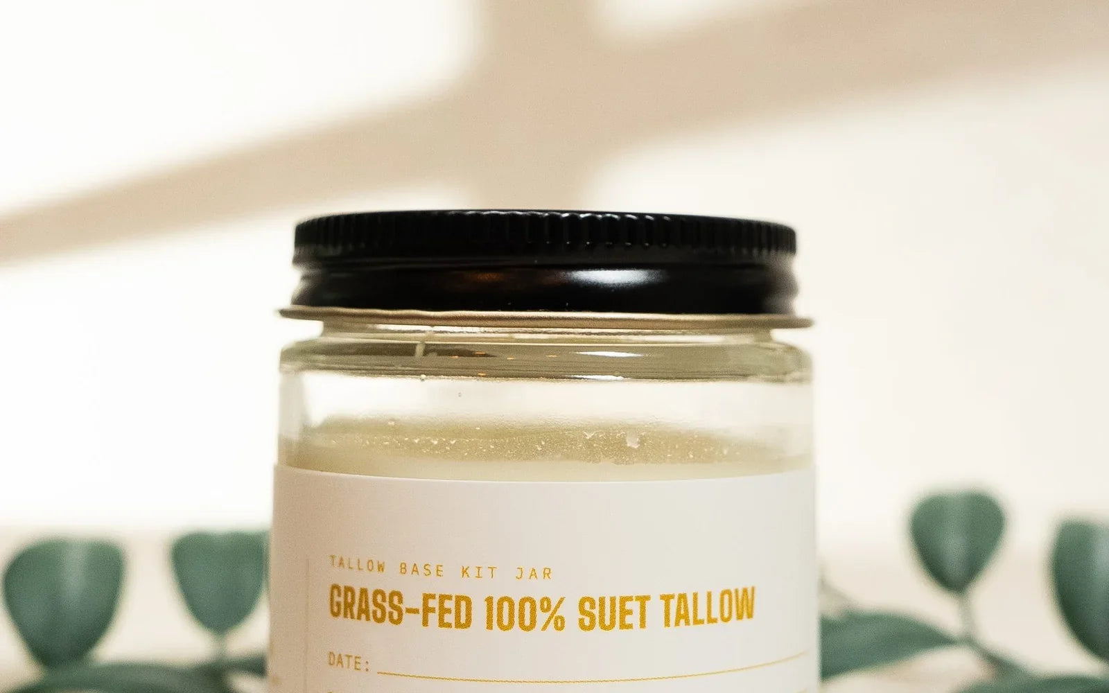 A labeled jar of grass-fed 100% suet tallow