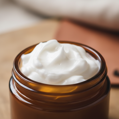 Close-up of whipped tallow in amber glass jar showing fluffy texture