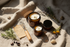 The Zero-Mess Apothecary Kit — amber glass jars, whisk wand, and recipe card on linen